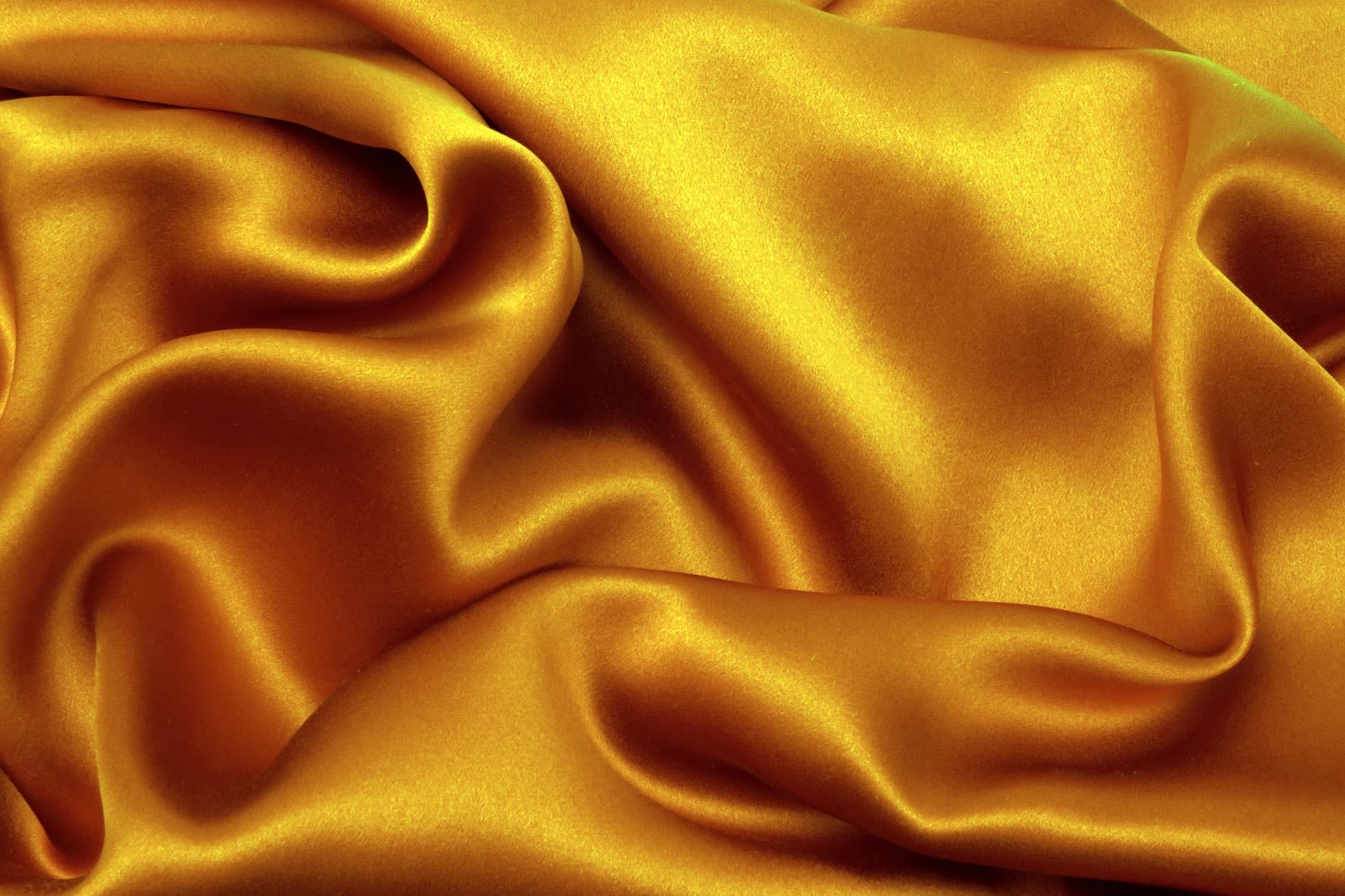 Rich gold silk fabric, folded and draped